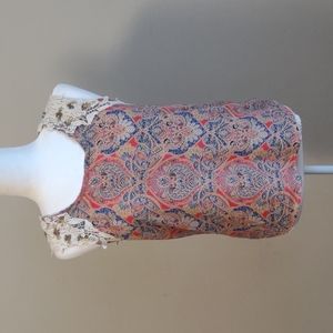 Miss Me sleeveless pullover top with crocheted and beaded detail. Lined.…